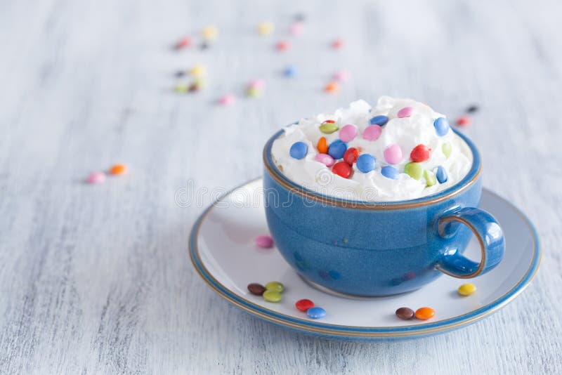 Coffee with Whipped Cream and Colorful Chocolate Drops Stock Image