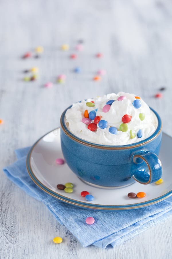Coffee with Whipped Cream and Colorful Chocolate Drops Stock Photo