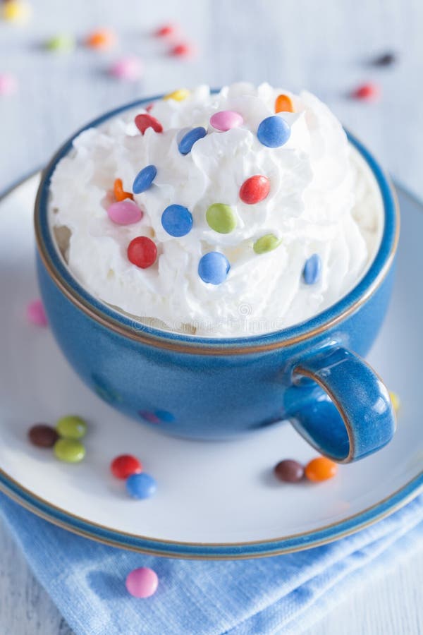 Coffee with Whipped Cream and Colorful Chocolate Drops Stock Photo