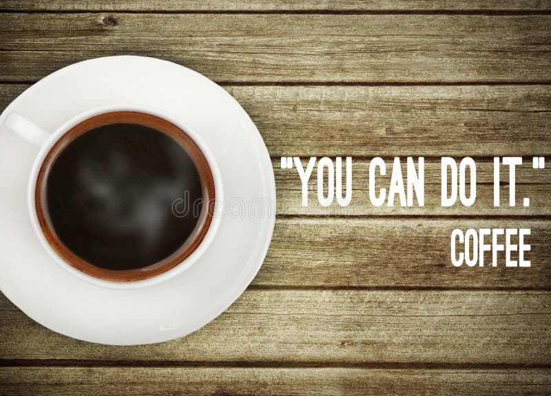 Coffee on wooden table with motivation quote royalty free stock images