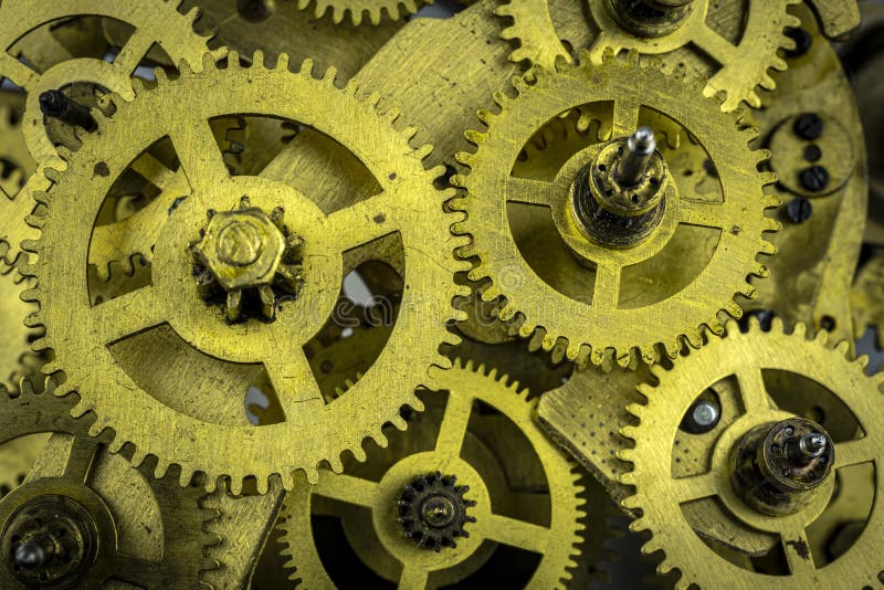 Cog-wheels from the bronze of nonworking mechanism as a background stock images