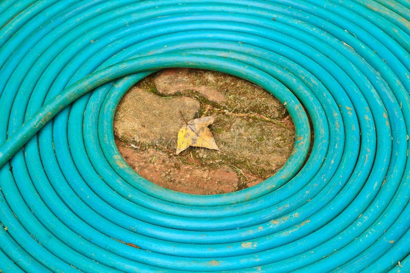Coiled rubber tube stock photo. Image of outdoor, field 38276334