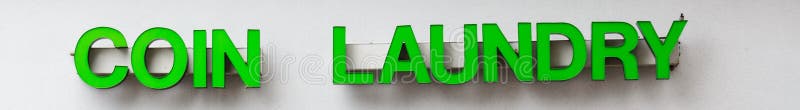 Coin Laundry Sign In Green Letters royalty free stock photos Coin Laundry Sign In Green Letters royalty free stock photos