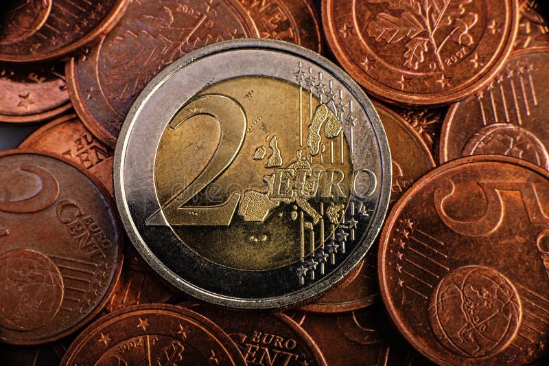 Coin worth two euros is on coins. Euro money.