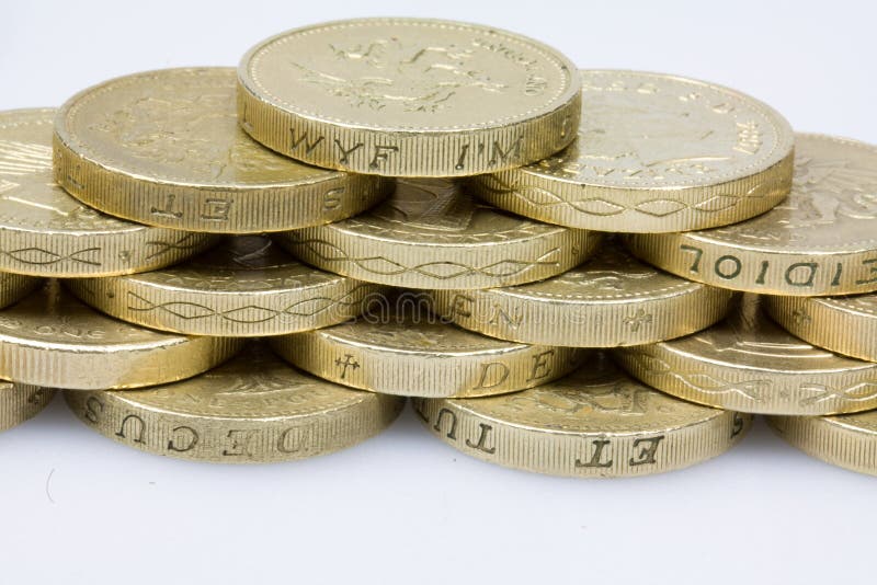 Coins in brick work pile