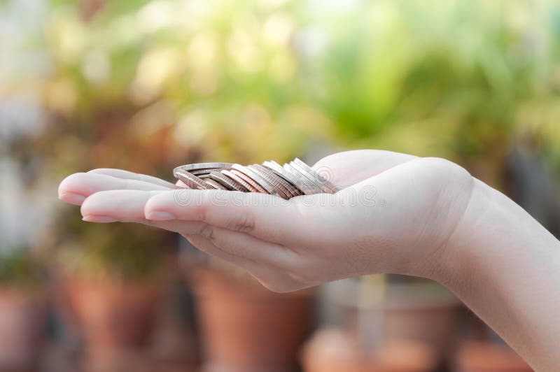 Coins in hands saving,Donation Investment Fund Financial Support Charity Dividend Market House Stock Trust Wealthy Giving Planned Accounting Collection Debt Banking ROI