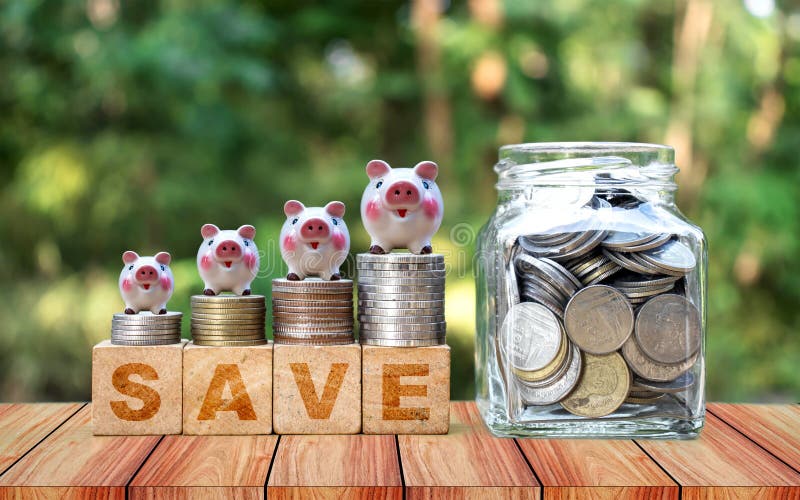 Coins placed on wooden signs, blocks and messages help you save money royalty free stock image Coins placed on wooden signs, blocks and messages help you save money royalty free stock image