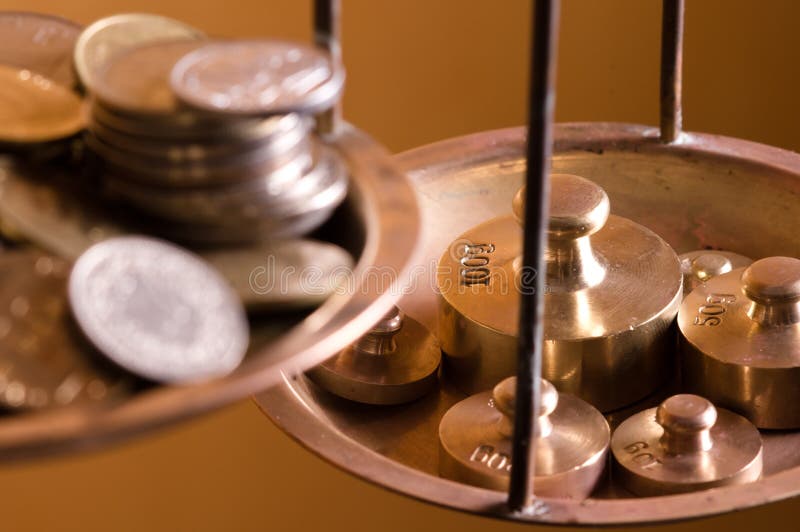 Coins on a scale weight stock photo. Image of brass, estimate - 21804006