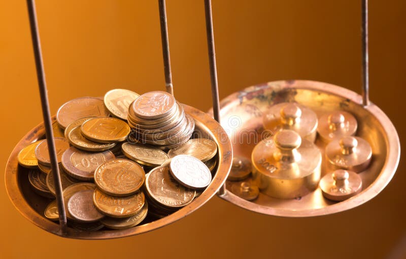 Coins on a scale weight stock photo. Image of brass, estimate - 21804006