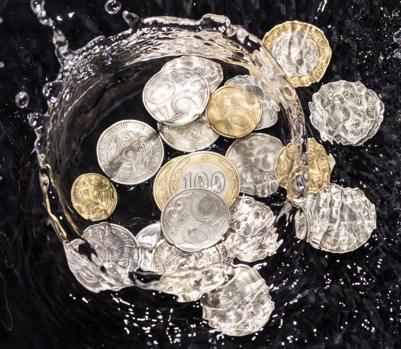 Coins in Water Splashes on a Black Background Stock Photo Image of