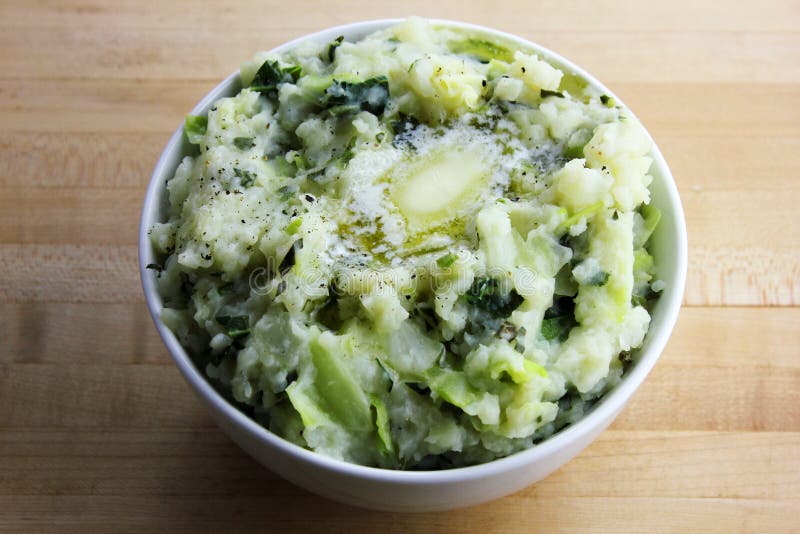 Colcannon. A bowl of homemade colcannon topped with melting butter royalty free stock photo