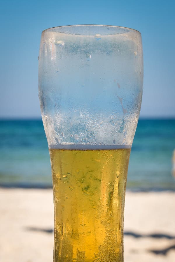 Photo Of Cold Beer Botle In The Sand. Sparkling Sea At The Background.  Stock Photo, Picture and Royalty Free Image. Image 35894710.