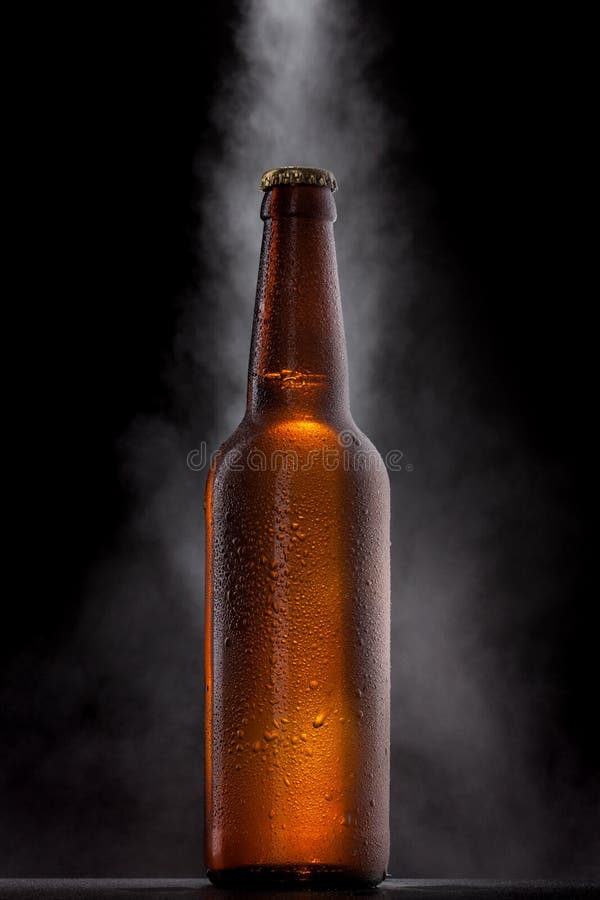Cold beer bottle with drops