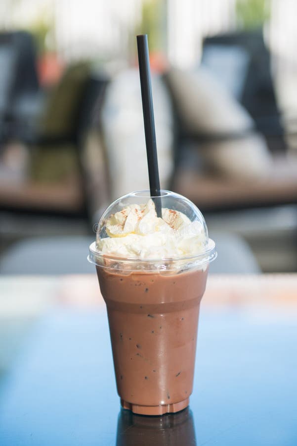 Cold Chocolate Milk with Whipped Cream in Plastic Glass Stock Photo
