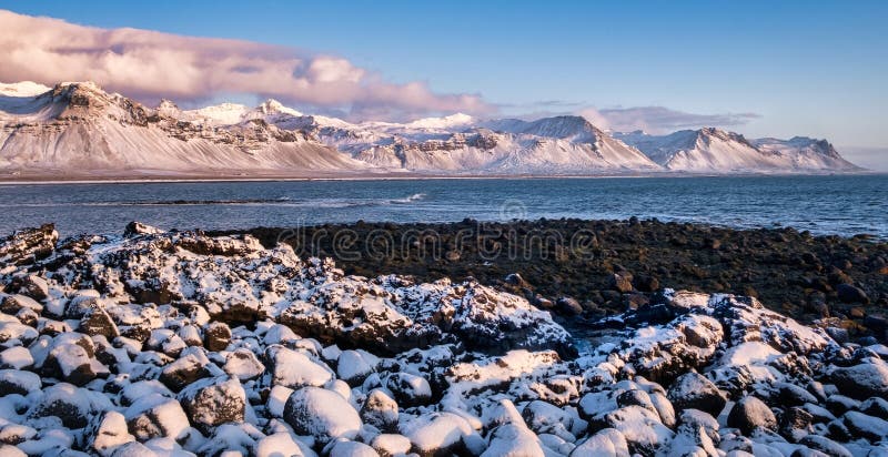 Cold clear winter morning panoramic view of beach in Atlantic ocean in Iceland