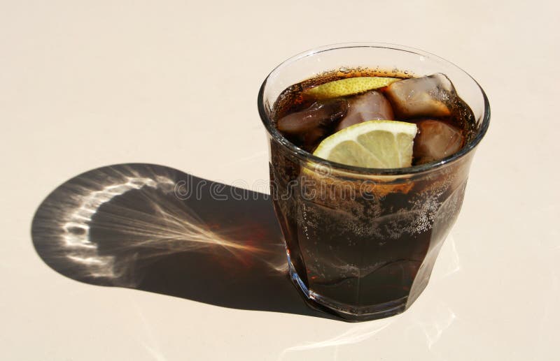 Cold Fizzy Cola Soda With Ice In Glass Cup Stock Photo - Download