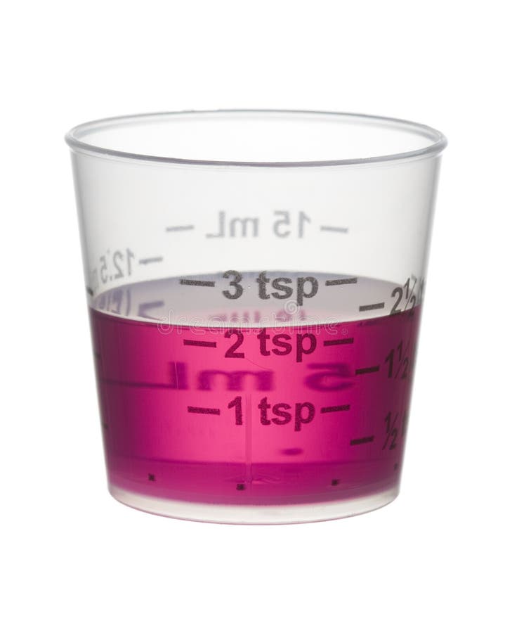 Cold or Cough Syrup Medicine in a Measuring Cup Isolated on Whit Stock