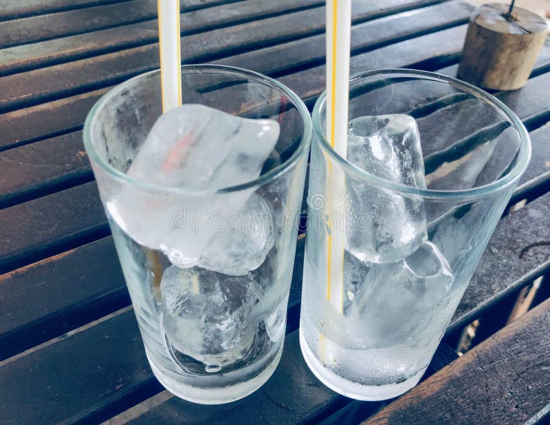 Cold ice, clear glass, two glasses royalty free stock photos Cold ice, clear glass, two glasses royalty free stock photos