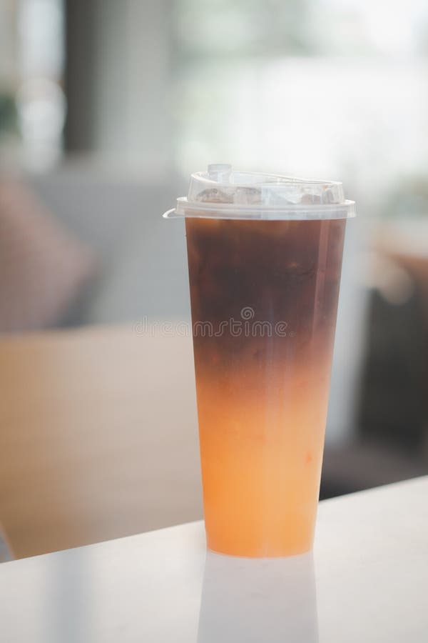 https://thumbs.dreamstime.com/b/cold-iced-black-brew-coffee-mixed-orange-juice-glass-cold-iced-black-brew-coffee-mixed-orange-juice-glass-pieces-255444925.jpg