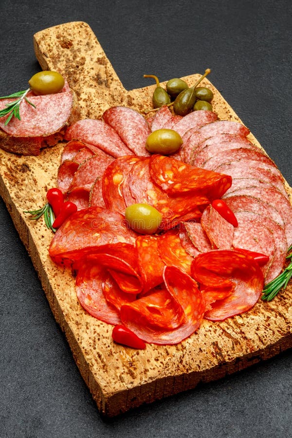 Cold Meat Plate With Salami And Chorizo Sausage On Cork Wood Board