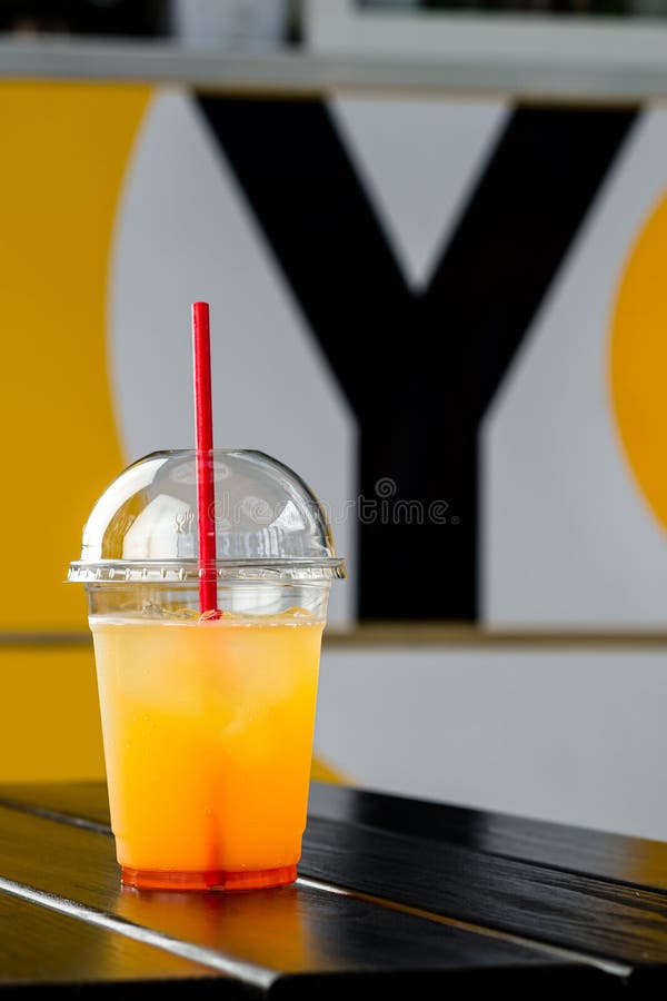 Cold Orange Lemonade in a Plastic Cup To Take Away Stock Photo Image