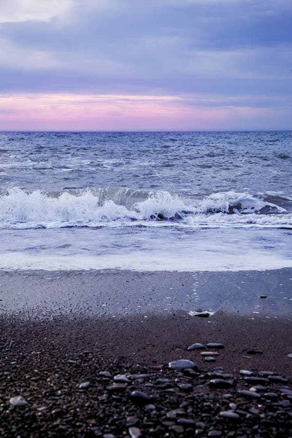 Cold Sea at Sunset. Waves on the Shore of a Pebble Beach Stock Image ...