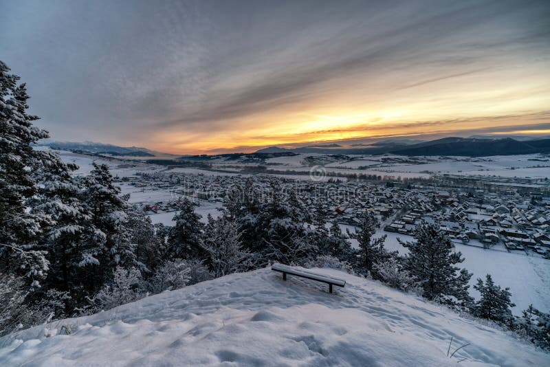 Cold snowy winter morning. Beautiful sunrise over village Liskova in Slovakia