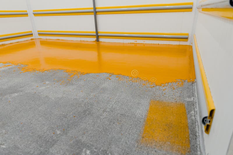 New Polished Concrete Floor Covered with a Layer of Yellow Epoxy Resin