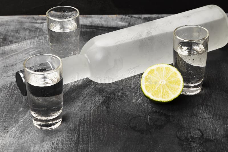 Cold Vodka in Shot Glasses on a Black Background Stock Image Image of lime, table 109623321