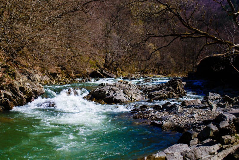 Cold water rushing through rocks in morning. Mountain stream. Spring landscape stock image Cold water rushing through rocks in morning. Mountain stream. Spring landscape stock image
