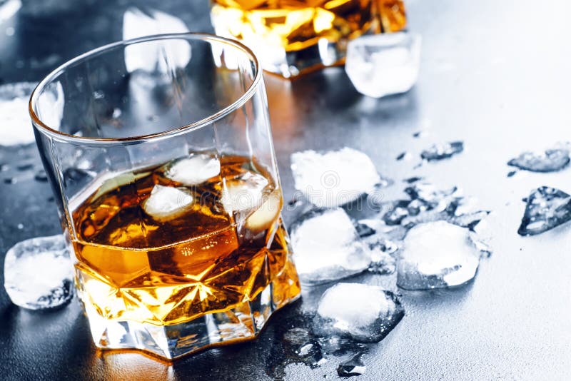 Cold Whiskey in a Glass with Crushed Ice on a Black Stone Wet Ba Stock Photo Image of whiskey