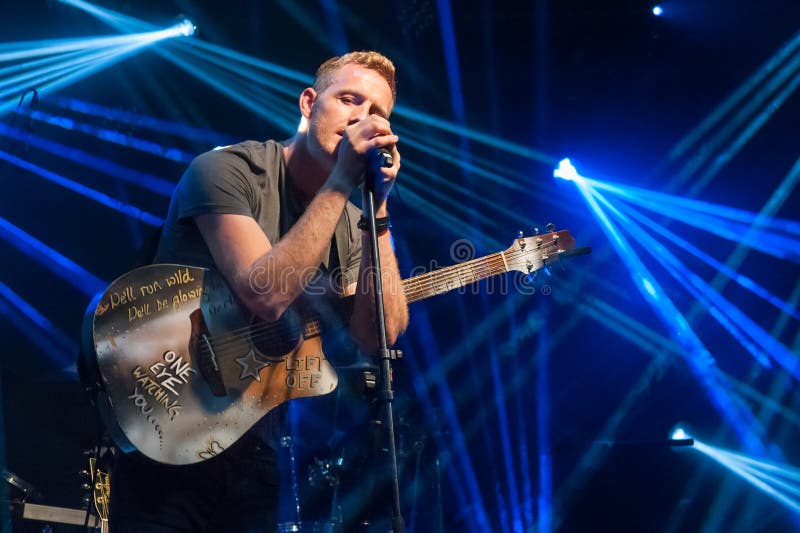 Yateley, UK - June 27, 2015: Shane Crofts, frontman and Chris Martin impersonator for a professional Coldplay tribute act at the GOTG festival in Yateley, UK