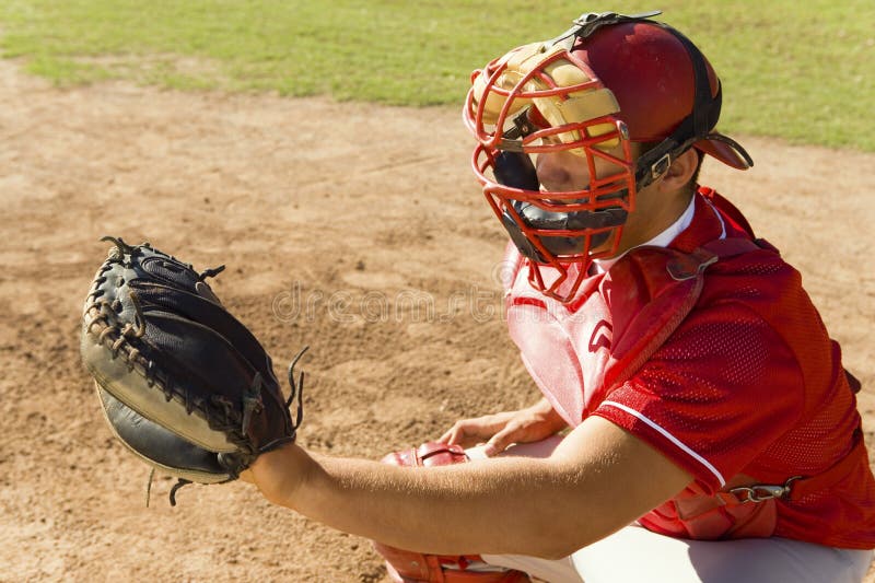 Baseball catcher ready to catch ball thrown by the pitcher. Baseball catcher ready to catch ball thrown by the pitcher