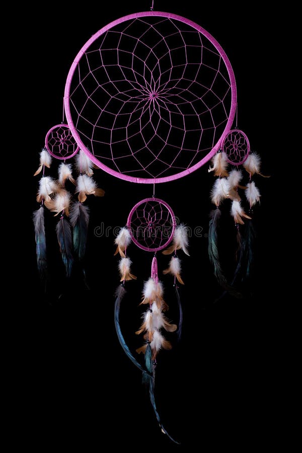Pink dream catcher with one big circle, three small circles and feathers isolated on black. Pink dream catcher with one big circle, three small circles and feathers isolated on black