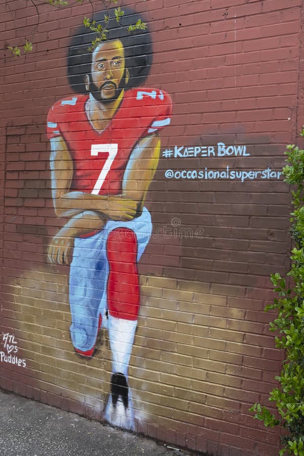 Graffiti drawing of Colin Kaepernick kneeling painted on a brick wall on Boulevard Ave in Atlanta, Georgia. Graffiti drawing of Colin Kaepernick kneeling painted on a brick wall on Boulevard Ave in Atlanta, Georgia