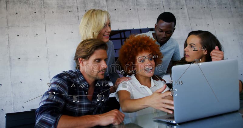 Collaborating in office, diverse colleagues using laptop with animation data overlay stock video footage