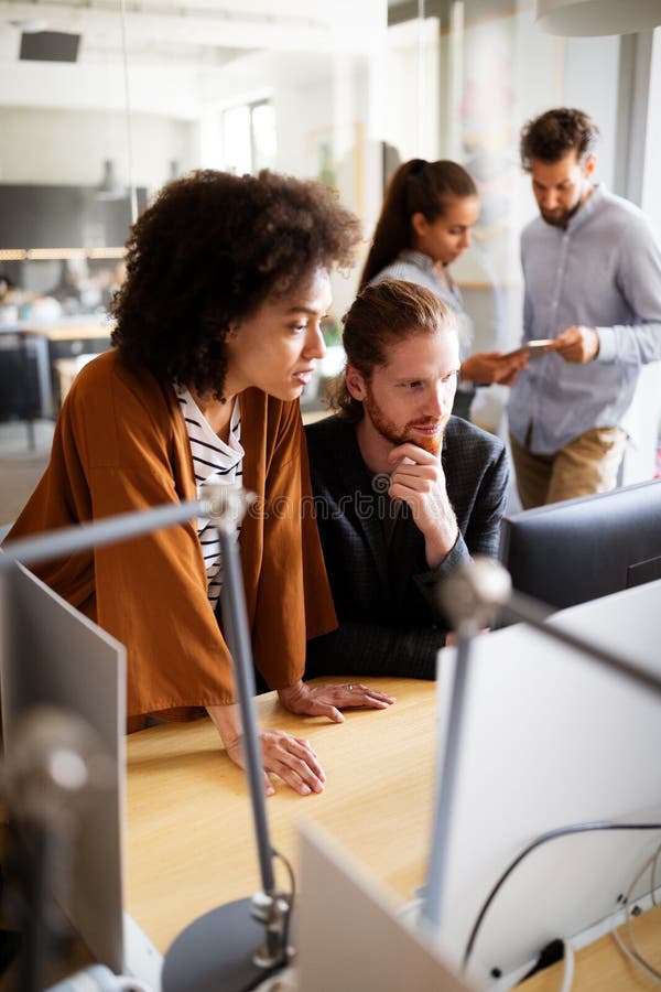 Collaboration and Analysis by Business People Working in Office Stock