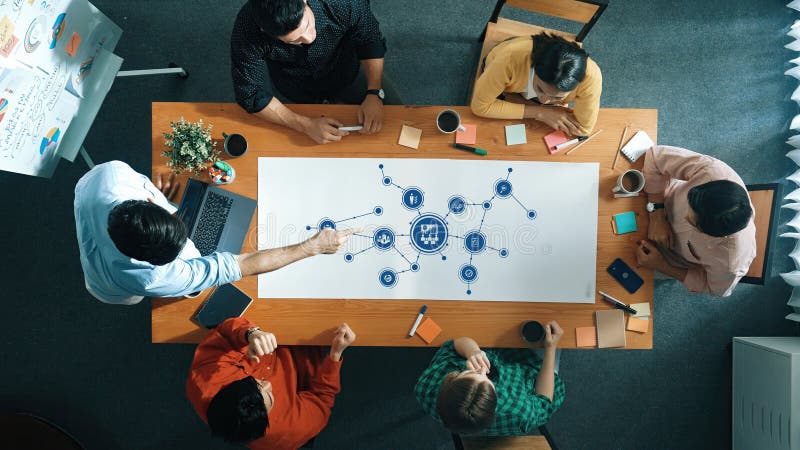 Collaborative Strategy Meeting Focused on Management Concepts and Planning in a Modern Office Environment. Amity stock photo