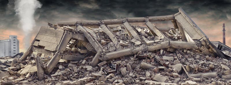 Collapsed concrete industrial building isolated on white background with dramatic sky and factory chimney and another