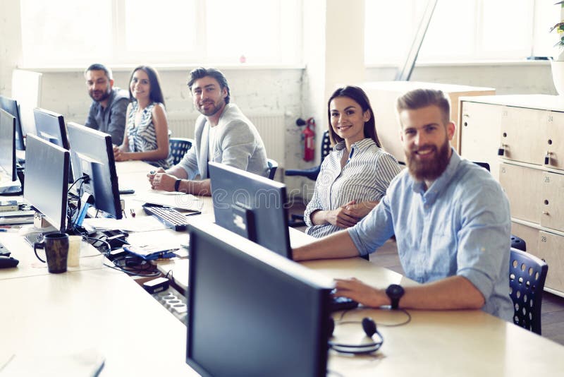 Colleagues are concentrated on their work, finding the solutions of their company problems, sitting at work places in a royalty free stock photos Colleagues are concentrated on their work, finding the solutions of their company problems, sitting at work places in a royalty free stock photos