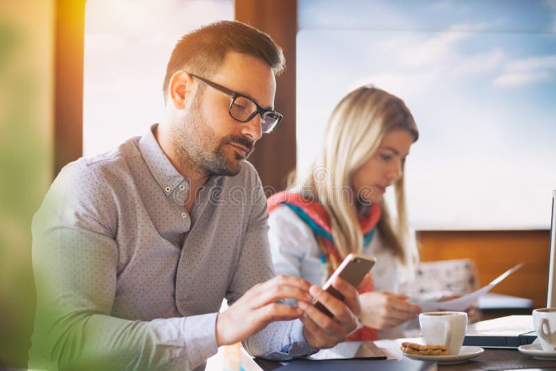 Colleagues making a break in a coffee bar stock photography Colleagues making a break in a coffee bar stock photography