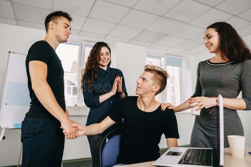 Colleagues shaking hands and applauding stock images Colleagues shaking hands and applauding stock images