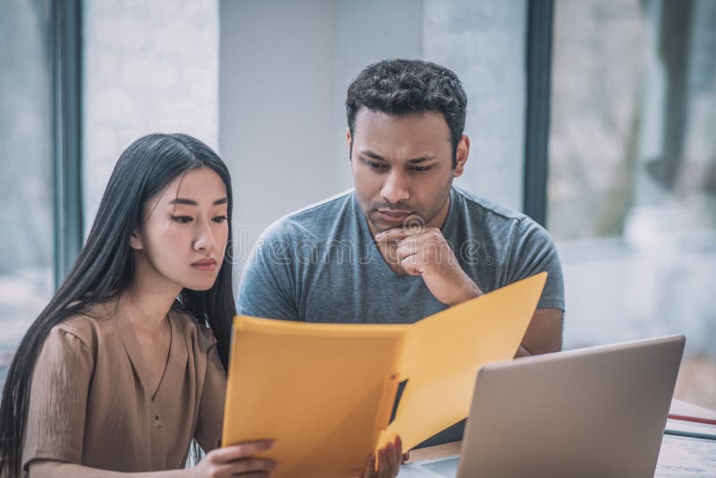 Colleagues working in the office and looking concentrated royalty free stock image