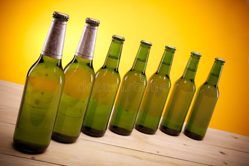 Collection of Bottled Beer on Yellow Stock Photo Image of light