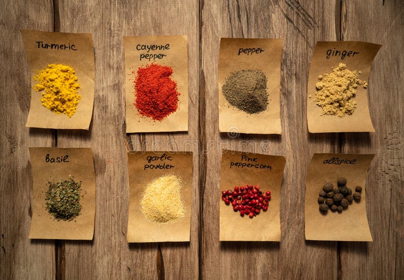 Collection of Bright Spices on Craft Paper Sheets. Top View Stock Image