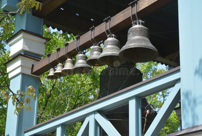 A collection of bronze, cup-shaped church bells housed in the bell tower of a church which are rung within the liturgy, feasts