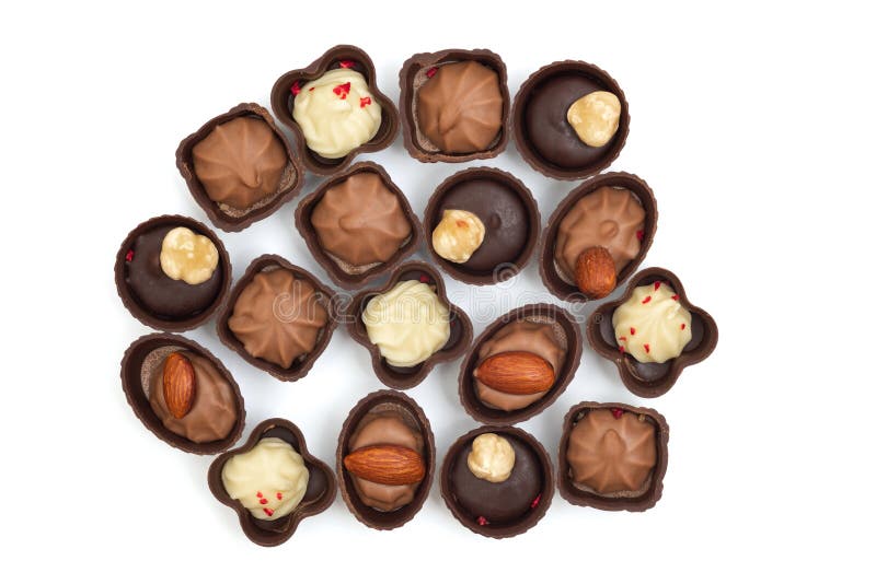 Collection of chocolates on a white background. Confectionery products, top view