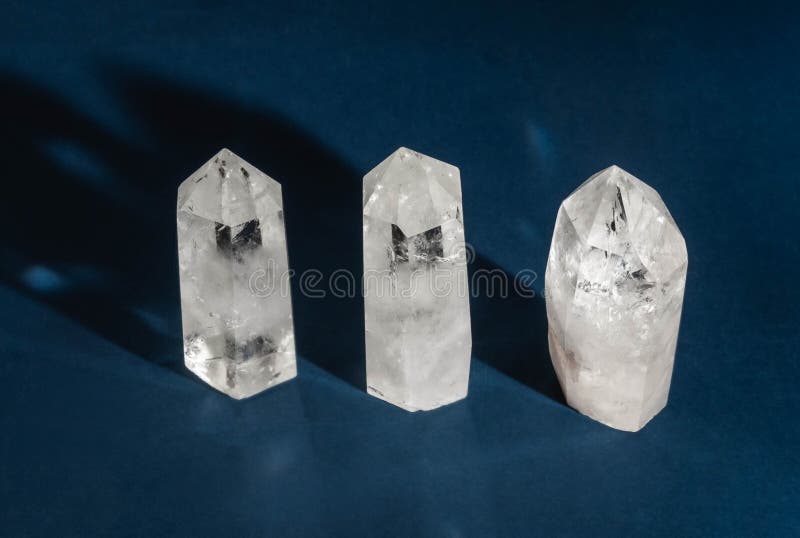 Collection of Crystals Quartz on Dark Blue Background with Shadows Stock Photo Image of