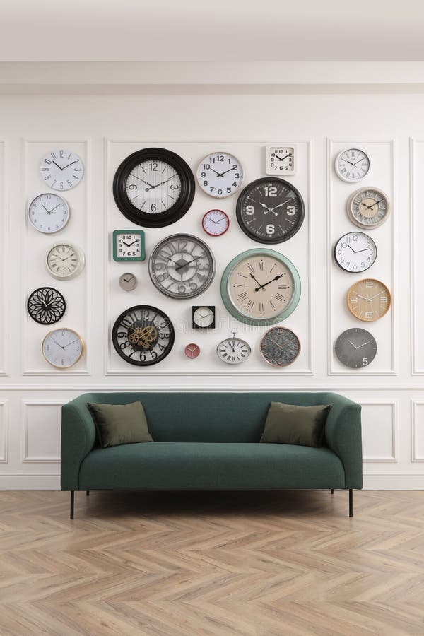 Collection of Different Clocks and Comfortable Sofa in Stylish Room