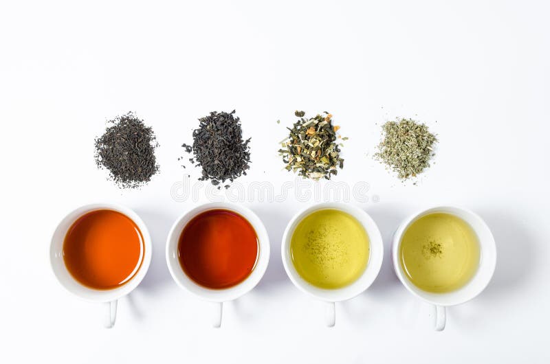 Collection of Different Teas in Cups with Tea Leaves on a White
